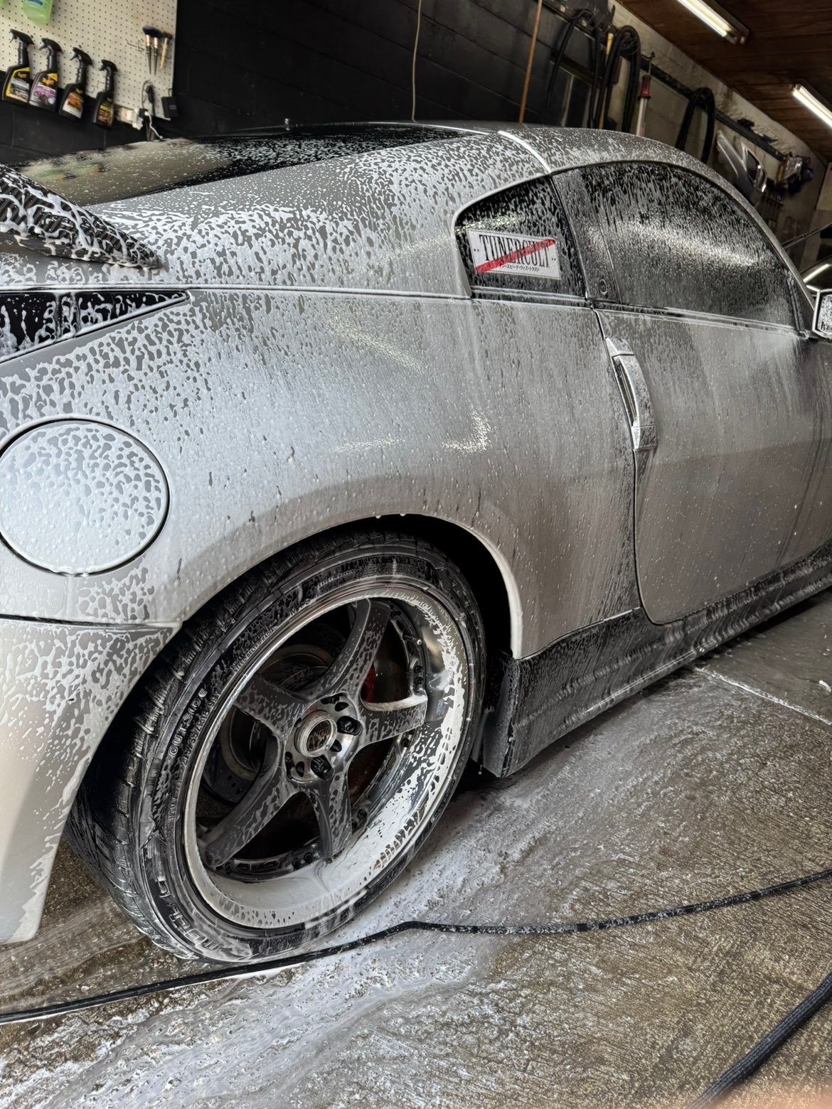 Nissan 350Z covered in foam during a hand wash