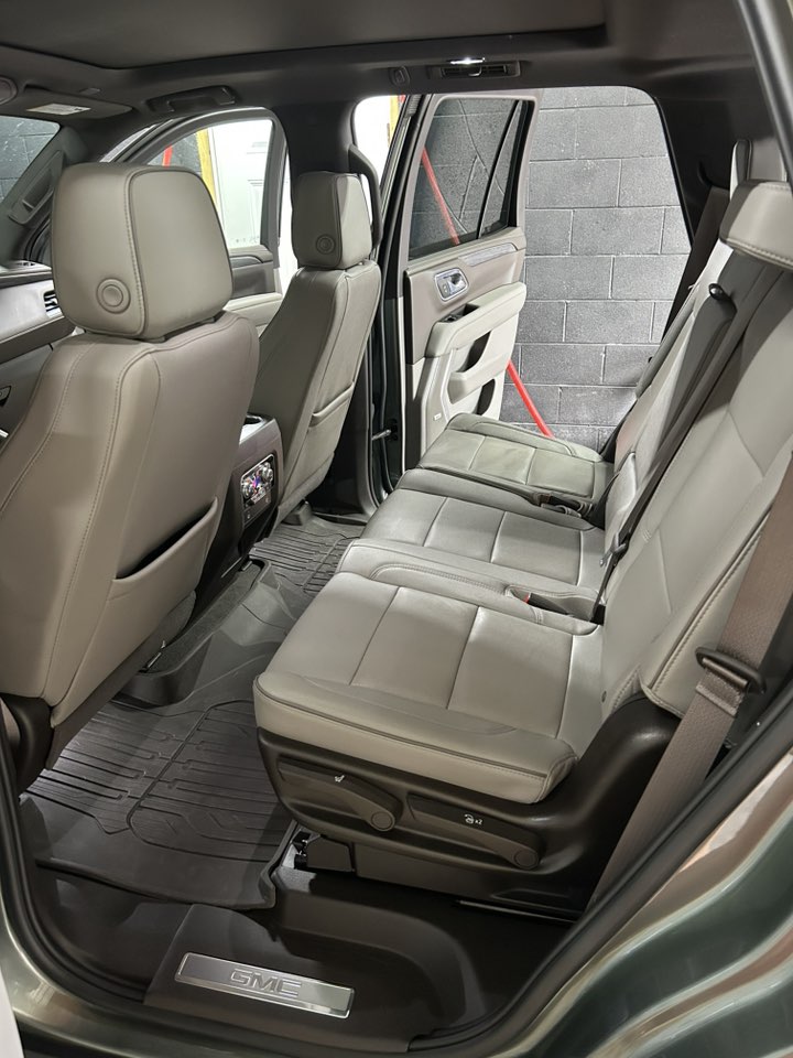 Clean grey GMC SUV interior rear seats