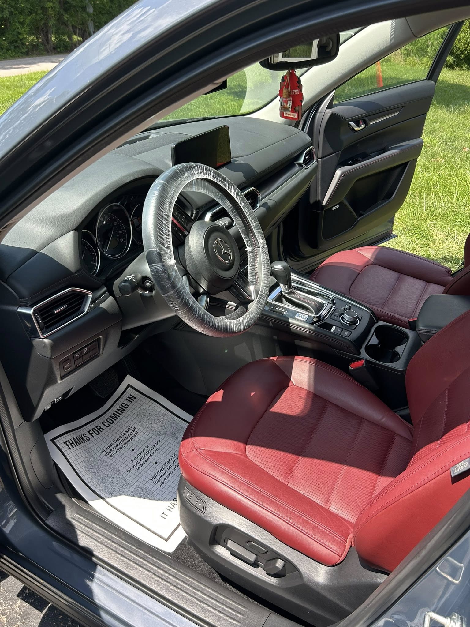 Clean Mazda CX-5 interior driver's side with red seats